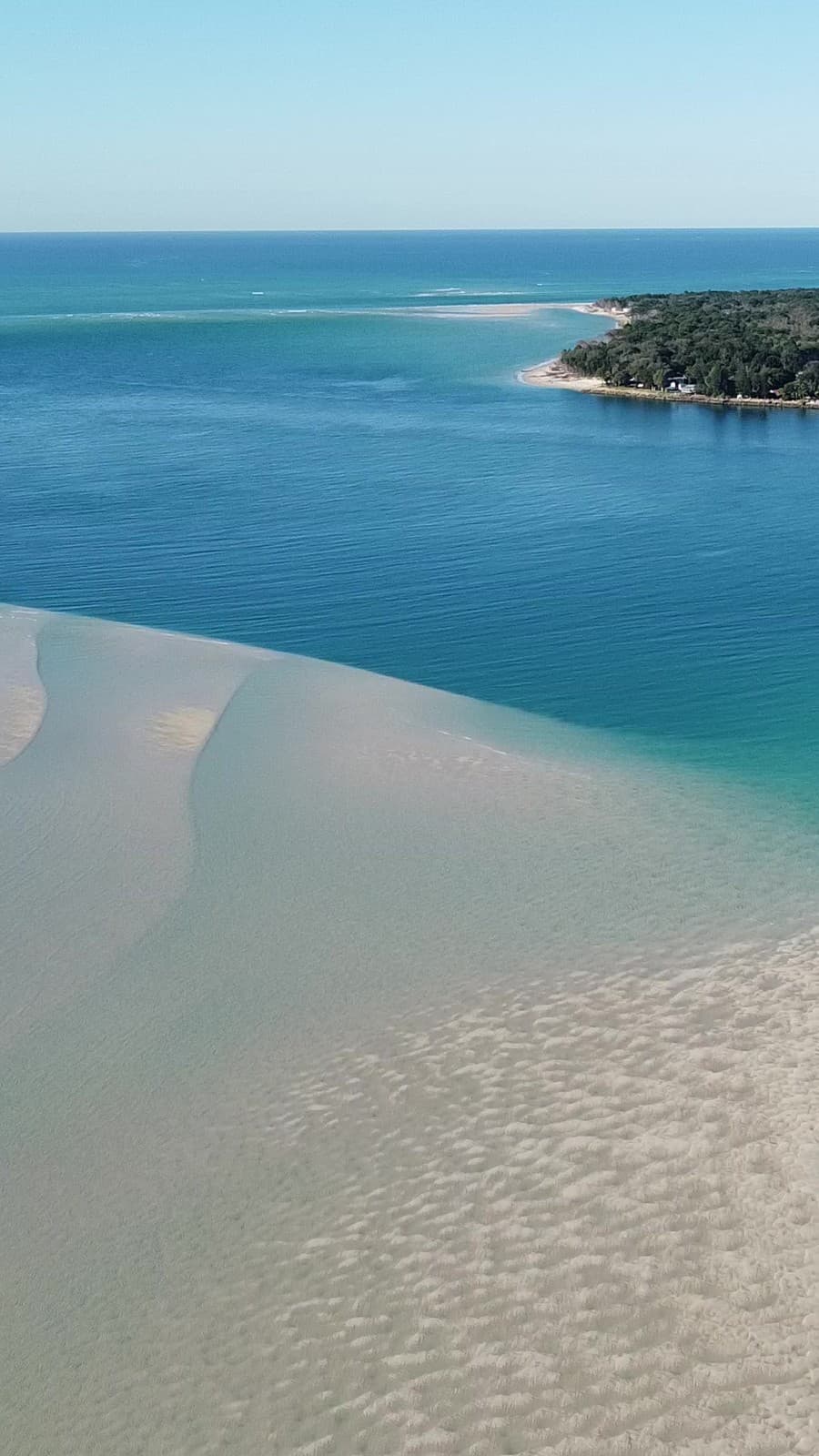 High aerial of the Amity sandbanks where pale sand meets a deep emerald channel