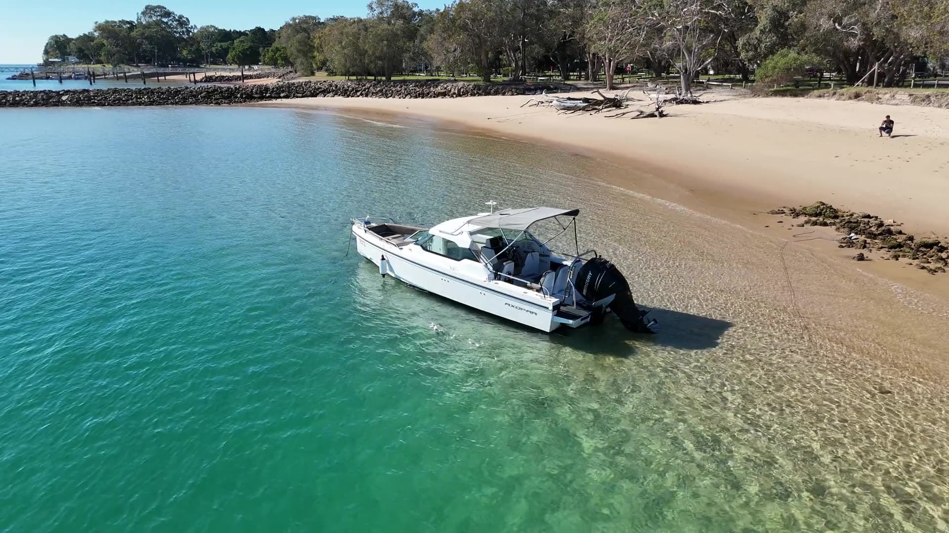 Aerial orbit of the charter boat beached on the sand spit at Amity